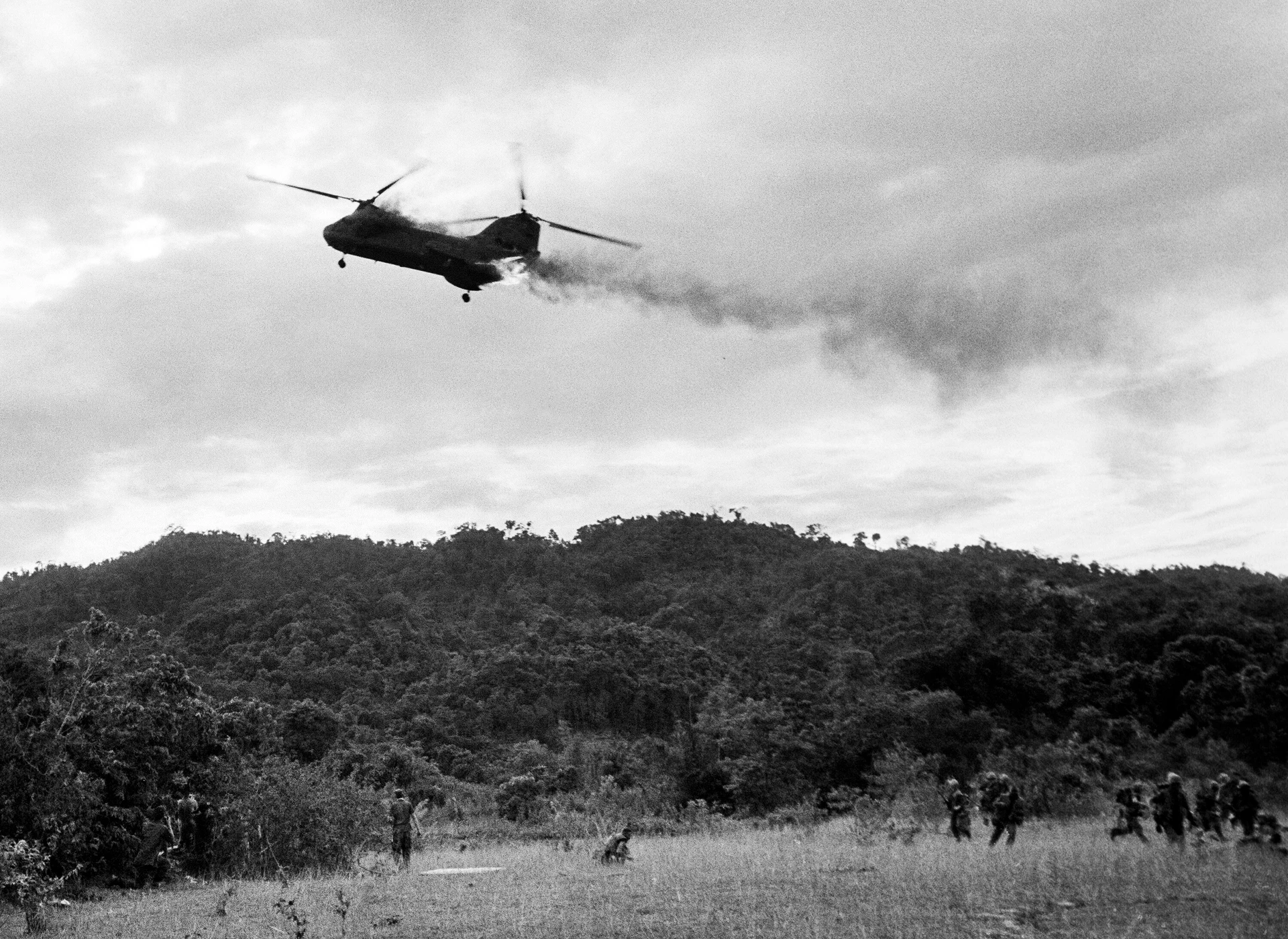 Black & white image, vietnam war, burning helicopter