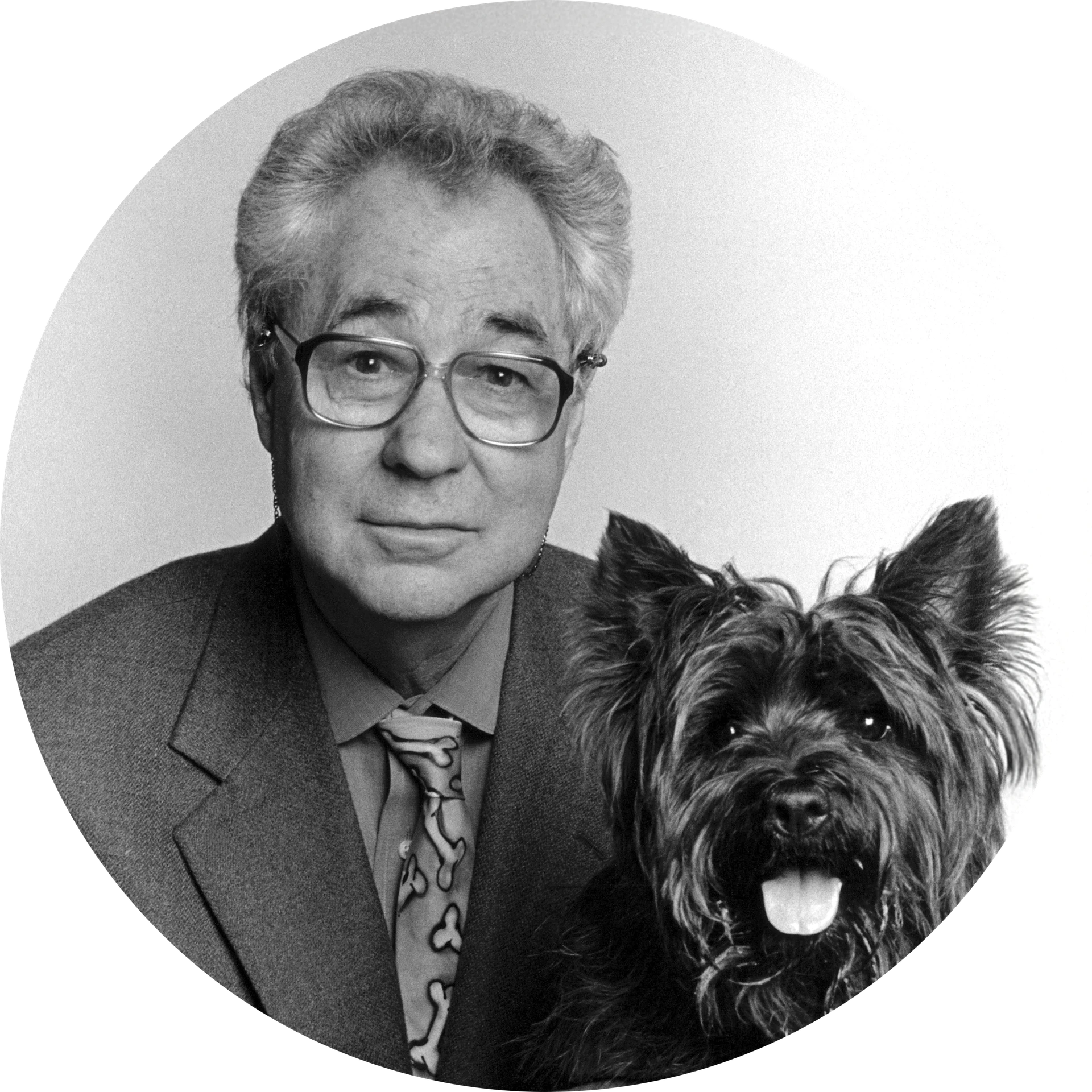 Black and white portrait of Elliott Erwitt with a dog